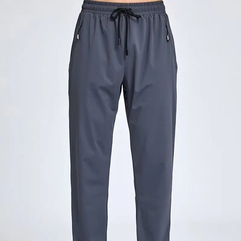 Pantalones de primavera y otoño sueltas de los deportes masculinos, entrenamiento con pantalones casuales, pantalones de protecc