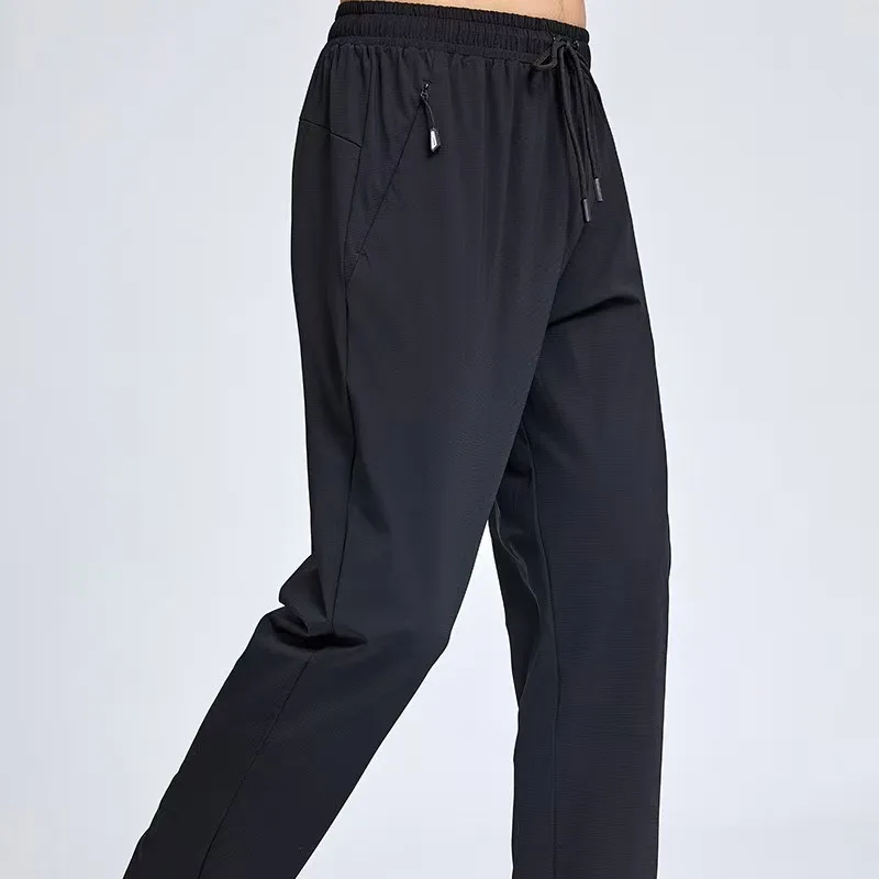 Pantalones de primavera y otoño sueltas de los deportes masculinos, entrenamiento con pantalones casuales, pantalones de protecc