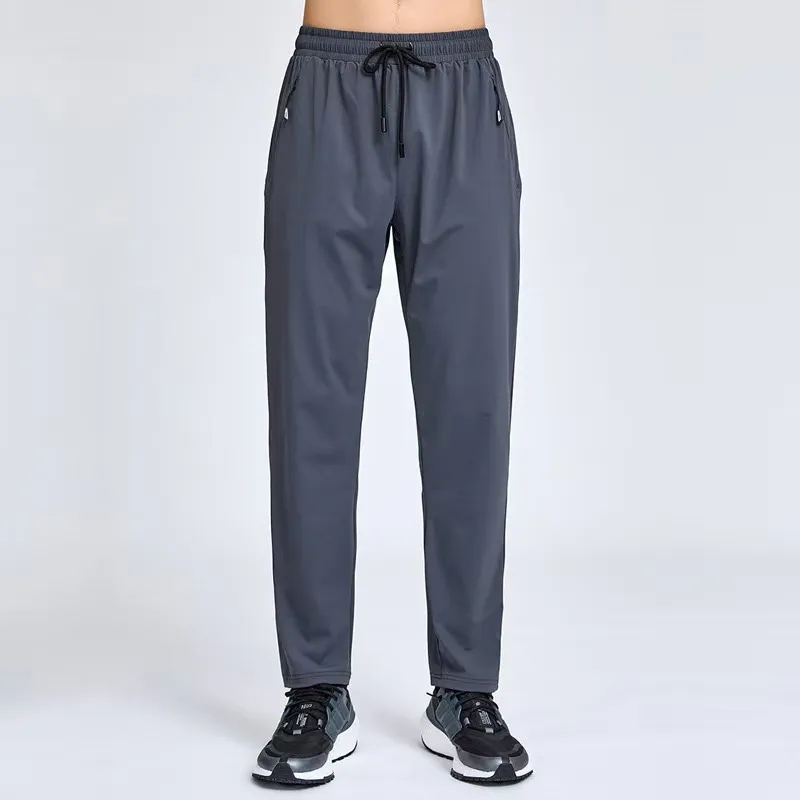 Pantalones de primavera y otoño sueltas de los deportes masculinos, entrenamiento con pantalones casuales, pantalones de protecc