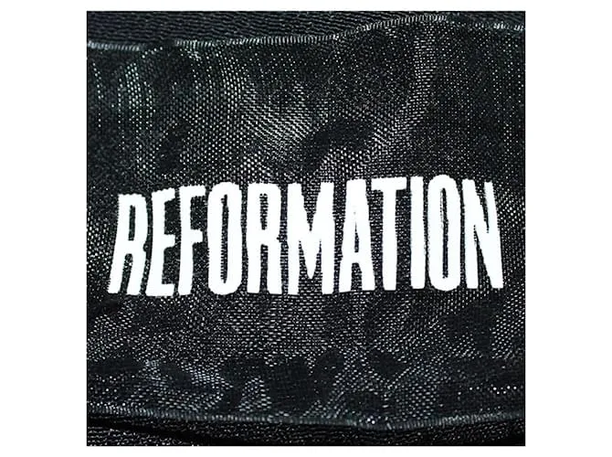 Reformation Pantalones anchos de viscosa con estampado floral 